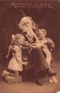 CHILDREN WITH SANTA-GAY & BRIGHT-FULL OF FUN~TUCKS CARBONETTE CHRISTMAS POSTCARD