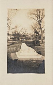 YOUNG BOY SITS ON END OF CANNON-PROBABLY WICHITA KS ~1910s REAL PHOTO POSTCARD