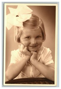 Vintage 1910's RPPC Postcard Portrait of Cute Girl with Bow in Hair