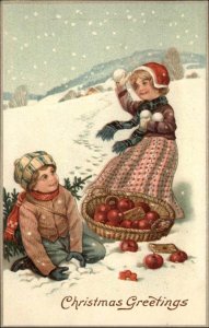 Christmas - Children Boy Girl Snowball Fight Apples c1910 Embossed Postcard