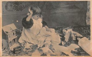 CHILD SPANKING HER DOLL TOYS POSTCARD (c. 1910)