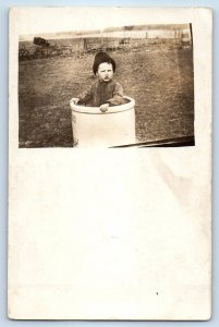 c1910's Little Boy On Stoneware Crock Western RPPC Photo Antique Posted Postcard