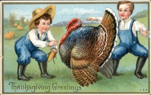 Thanksgiving Farmer Boys Coax Turkey Embossed c1900-20s Vintage Postcard
