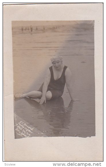 RP; Middle aged woman wearing bathng suit and cap on the beach, 10-20s