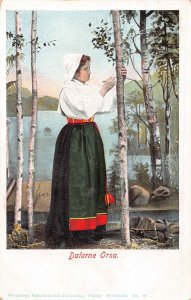 SWEDEN ~ DALARNE ORSA~WOMAN CARVING TREE~NATIOINAL COSTUME-1900s POSTCARD