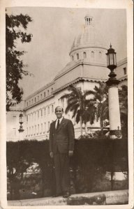 VINTAGE POSTCARD REAL PHOTO CARD (RPPC) OF ANONYMOUS MAN IN FRONT OF BUILDING