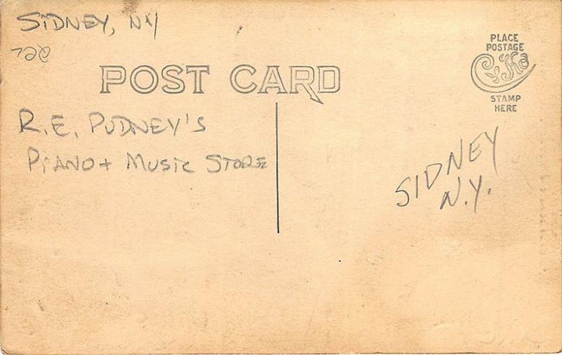 R. E. Pudney's Piano & Music Store RPPC Postcard 