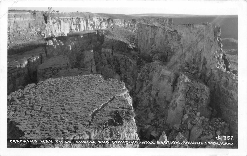 H28/ Sinking Farm Idaho RPPC Postcard c30s Cracking Hay Field Chasm Geology