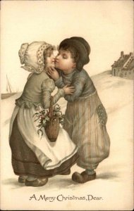 Nister Christmas Little Boy Kisses Dutch Girl c1910 Vintage Postcard