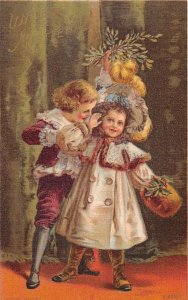 Christmas Greetings Children and Mistletoe Vintage Postcard AA15940