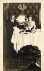 RPPC Postcard Victorian Interior Couple at Set Dining Room Table Unknown US