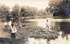 PEOPLE FISHING-YOUNG BOY HOLDS CAUGHT FISH~1910s REAL PHOTO POSTCARD