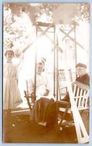 1910-20's RPPC FACE TO FACE DOUBLE GLIDER SWING TWIG CHAIR 3 PEOPLE POSTCARD