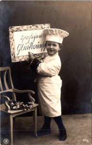 RPPC, Studio Portrait LITTLE BOY In CHEF'S HAT & APRON Kind Regards?  Postcard