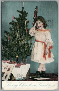 LITTLE GIRL w/ CHRISTMAS TREE 1906 ANTIQUE POSTCARD