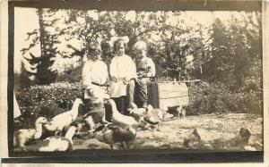 c1910 RPPC Postcard Children Feed Ducks & Ducklings Unknown US Location Unposted