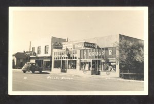 RPPC WELLS NEVADA DOWNTOWN STREET SCENE FRUG STORE CARS REAL PHOTO POSTCARD