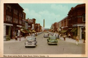 Postcard ON Owen Sound Main Street Old Cars Street Lamp Shops 1930s K61