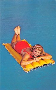 On A Raft Bathing Beauty Pin-Up Girl Swimming Risque 1960s Vintage Postcard