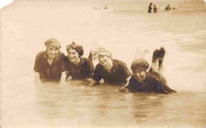 Women Bathing Beauties Lying in Beach Surf 1910s Real Photo postcard