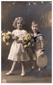 Girl and Boy, each holding Bouquet flowers