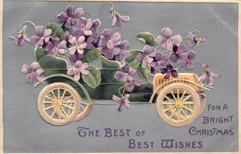 L293 Christmas Greetings 1910 Flowers convertible car embossed postcard
