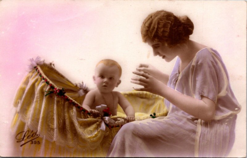 Hand Colored Real Photo Postcard Photo Studio Mother with Baby in Bassinet