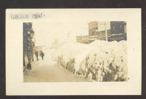 RPPC LINCOLN MONTANA DOWNTOWN STREET WINTER SNOW REAL PHOTO POSTCARD