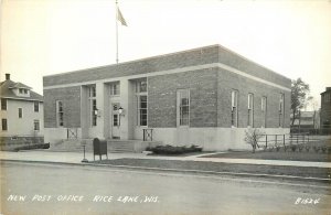 Postcard 1940s Wisconsin Rice Lake New Post Office Flag occupation WI24-4782