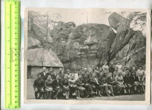 476554 USSR 1968 Ukraine Carpathians group resting near rock in forest PHOTO