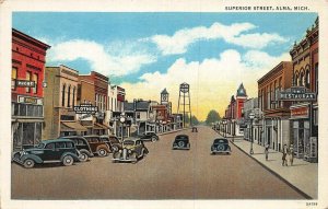 ALMA MICHIGAN~SUPERIOR  STREET- STOREFRONTS-SIGNS-CARS 1930's POSTCARD