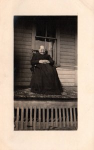 Old Woman on Porch BIN