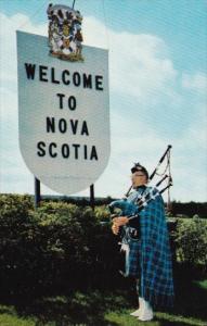 Canada Piper At Welcome Sign Nova Scotia