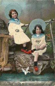 GIRLS DRESSED IN SAILOR COLLARED OUTFITS WITH LARGE HATS UDB POSTCARD c1907