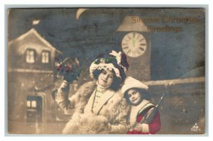 Vintage 1921 RPPC Christmas Postcard Mother & Daughter Clocktower Red Roses NICE