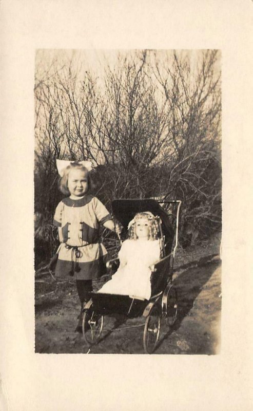 RPPC Girl & Doll in Baby Carriage Antique Toy c1910s Vintage Postcard