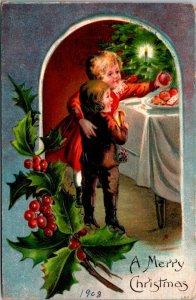 Christmas PC Two Children Reaching For Food on a Plate Candlelit Tree Holly