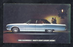 1966 OLDSMOBILE NINETY EIGHT SEDAN CAR DEALER ADVERTISING POSTCARD WAUKESHA WIS