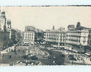 old rppc OLD CARS BY SHOPS ALONG STREET Madrid Spain HM1944