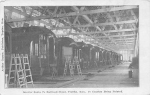 Interior Santa Fe railroad shops Coaches being painted Topeka Kansas  