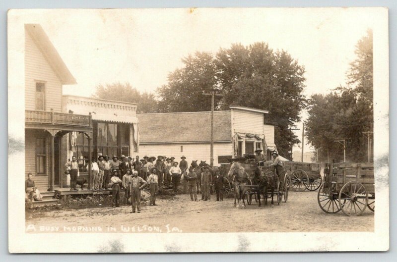 Welton Iowa~Busy Morning on Main Street~Hard Working Men~Farm Wagons~1910 RPPC 