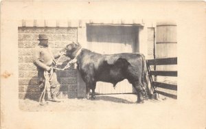 J31/ Interesting RPPC Postcard c1920s Man With Cow Bull Farmer Barn 190