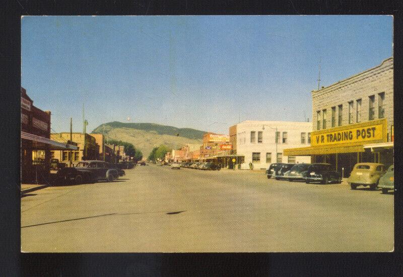 CODY WYOMING 1950's CARS DOWNTOWN STREET SCENE STORES VINTAGE POSTCARD