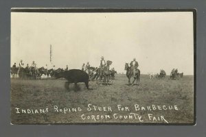 McIntosh SOUTH DAKOTA RPPC c1910 SIOUX INDIANS Indian ROPING COW for BARBECUE