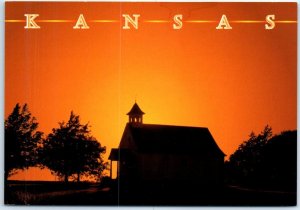 A rural church basks in the golden light & tranquil beauty of Kansas prairie, KS