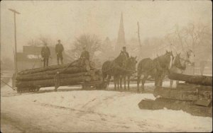 Lumberjacks Logging Crew Horses Pulling Logs in Snow Real Photo Postcard