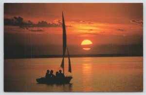 State View~Cape Cod Massachusetts~Sunset Silhouettes Folks In Sailboat~Vtg PC