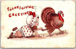 1913 Thanksgiving Greetings Baby Crawling Touch Feet Of Turkey Posted Postcard