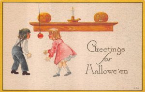 CHILDREN APPLE JOL CANDLE HALLOWEEN HOLIDAY GIBSON POSTCARD (c. 1910)
