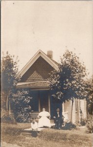 RPPC Lovely Victorian Family Front of Cottage Mother White Dress Postcard H27